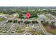 Aerial view displays a neighborhood location pin near ponds, showcasing its convenient placement at 13686 Whiskey Daisy Dr, Dade City, FL 33525