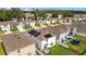 Aerial view of homes with solar panels, a fenced yard, and a trampoline at 13686 Whiskey Daisy Dr, Dade City, FL 33525