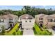 Aerial view of the home with solar panels on the roof at 13686 Whiskey Daisy Dr, Dade City, FL 33525