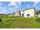 Backyard features a lawn, privacy fence, patio and room for outdoor enjoyment at 13686 Whiskey Daisy Dr, Dade City, FL 33525