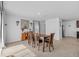 Bright dining area featuring a wooden table and chairs, complemented by stylish decor at 13686 Whiskey Daisy Dr, Dade City, FL 33525