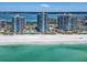 Serene aerial view of beachside condos with pools, lush landscaping, and stunning ocean and bay views at 1520 Gulf Blvd # 1505, Clearwater Beach, FL 33767