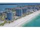 Beautiful aerial view of beachfront condo towers with pool amenities, on pristine beach overlooking the water at 1520 Gulf Blvd # 1505, Clearwater Beach, FL 33767