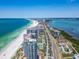 Panoramic aerial view of beachfront condos, coastline, and cityscape, showcasing the desirable location at 1520 Gulf Blvd # 1505, Clearwater Beach, FL 33767