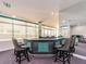 Bar area with high top chairs and a mirrored wall, located next to the lounge area at 1520 Gulf Blvd # 1505, Clearwater Beach, FL 33767