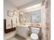 Cozy bathroom featuring a vanity, toilet, and seashell-themed decorations at 1520 Gulf Blvd # 1505, Clearwater Beach, FL 33767