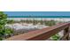 The beach is visible from a wooden walkway with sandy dunes and beach vegetation at 1520 Gulf Blvd # 1505, Clearwater Beach, FL 33767
