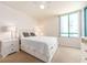 Bright bedroom with a large window and neutral decor at 1520 Gulf Blvd # 1505, Clearwater Beach, FL 33767