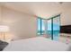 Bedroom features a balcony with ocean views, neutral walls, and carpeted floors at 1520 Gulf Blvd # 1505, Clearwater Beach, FL 33767