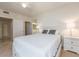 Bedroom features carpet, a closet, an attached bathroom, and neutral paint at 1520 Gulf Blvd # 1505, Clearwater Beach, FL 33767