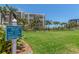Well-maintained croquet court with lush green lawn, surrounded by palm trees, providing recreational activities at 1520 Gulf Blvd # 1505, Clearwater Beach, FL 33767
