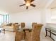 Cozy dining area with a glass-top table conveniently located next to living room at 1520 Gulf Blvd # 1505, Clearwater Beach, FL 33767