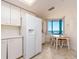 Bright kitchen features a dining area with beautiful ocean views and updated appliances at 1520 Gulf Blvd # 1505, Clearwater Beach, FL 33767