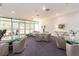Bright lounge space with multiple sitting areas, coffee tables, and a large glass window at 1520 Gulf Blvd # 1505, Clearwater Beach, FL 33767