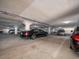 Secure underground parking garage providing ample space for residents' vehicles, shown with multiple parked cars at 1520 Gulf Blvd # 1505, Clearwater Beach, FL 33767