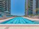Spacious outdoor lap pool between two high-rise buildings, perfect for exercise and relaxation at 1520 Gulf Blvd # 1505, Clearwater Beach, FL 33767