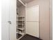 Storage room with white shelving and door, plus a darker door with padlock on the left at 1520 Gulf Blvd # 1505, Clearwater Beach, FL 33767