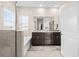Bathroom featuring dual vanity, tile flooring, and a bathtub with a shower combo at 1675 Bering Rd, Wesley Chapel, FL 33543