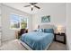 Cozy bedroom with a ceiling fan, large window, and a desk at 1675 Bering Rd, Wesley Chapel, FL 33543