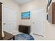 Entryway with storage cabinet, neutral walls, and a decorative rug at 1675 Bering Rd, Wesley Chapel, FL 33543
