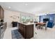 Gourmet kitchen with a large island and backyard pool view at 1675 Bering Rd, Wesley Chapel, FL 33543