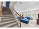 Open-concept living area with a staircase and great natural light at 1675 Bering Rd, Wesley Chapel, FL 33543