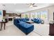 Bright living room featuring large windows, tile floors, and an open layout at 1675 Bering Rd, Wesley Chapel, FL 33543