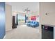 Bonus room with a blue couch, large window and sports-themed decor at 1675 Bering Rd, Wesley Chapel, FL 33543