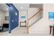 Staircase leading to the upper level of the home with modern railings at 1675 Bering Rd, Wesley Chapel, FL 33543