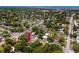An aerial view showcases the home's location in a tree-lined neighborhood close to community resources and shopping at 1683 Pine St, Largo, FL 33774