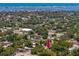 The aerial view shows the home located in a vibrant community with easy access to the ocean and nearby bridge at 1683 Pine St, Largo, FL 33774