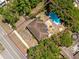 A high angle view of a quaint home surrounded by a lush green landscape at 1683 Pine St, Largo, FL 33774