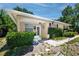 Exterior view of the home showcasing the entryway and garden at 1683 Pine St, Largo, FL 33774