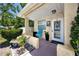 Cozy front porch with seating, plants, and a well-lit entrance at 1683 Pine St, Largo, FL 33774