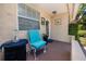 Inviting front porch with a cushioned chair and charming nautical decor at 1683 Pine St, Largo, FL 33774