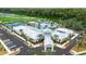 Exterior aerial showcasing the community clubhouse, lush landscaping, and convenient parking at 17282 Tortoise Crown Blvd, Land O Lakes, FL 34638