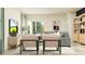 Well-lit living room with open floor plan, stylish seating and modern decor at 17282 Tortoise Crown Blvd, Land O Lakes, FL 34638