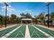 Community shuffleboard court with shelter and seating nestled amidst lush landscaping and scenic views at 17282 Tortoise Crown Blvd, Land O Lakes, FL 34638