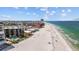 Breathtaking coastal view showcasing the beach, nearby buildings, and calm ocean at 17710 Gulf Blvd # 304, Redington Shores, FL 33708