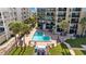 Aerial view of the complex showing a well-maintained pool and landscaping at 17710 Gulf Blvd # 304, Redington Shores, FL 33708