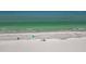 Expansive beach aerial highlighting the sandy shore and tranquil ocean, perfect for relaxing by the water at 17710 Gulf Blvd # 304, Redington Shores, FL 33708