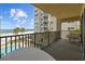 Enjoy breathtaking views of the beach from this condo's private balcony overlooking palm trees and a pool at 17710 Gulf Blvd # 304, Redington Shores, FL 33708