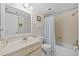 This bathroom includes a vanity with sink, a toilet, and a shower/tub combination with curtain at 17710 Gulf Blvd # 304, Redington Shores, FL 33708