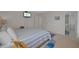 Cozy bedroom with a comfortable bed, a TV, an ensuite bathroom, and a serene atmosphere for relaxation at 17710 Gulf Blvd # 304, Redington Shores, FL 33708