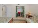 This bedroom includes a closet with storage and shelving, along with a desk and seating area at 17710 Gulf Blvd # 304, Redington Shores, FL 33708