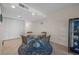 Charming dining area featuring a glass table and seating for four, adjacent to a storage closet at 17710 Gulf Blvd # 304, Redington Shores, FL 33708
