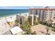Beachfront condo building with lush landscaping, parking, and beautiful views of the Gulf of Mexico at 17710 Gulf Blvd # 304, Redington Shores, FL 33708