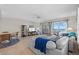 Bright living room with sliding glass doors to the balcony and an open layout to the dining area at 17710 Gulf Blvd # 304, Redington Shores, FL 33708