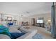 Bright and airy living room featuring tile floors, comfortable seating, and an open concept design with a dining area at 17710 Gulf Blvd # 304, Redington Shores, FL 33708