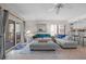 Inviting living room featuring a comfortable sectional sofa, a ceiling fan, and access to a private balcony at 17710 Gulf Blvd # 304, Redington Shores, FL 33708